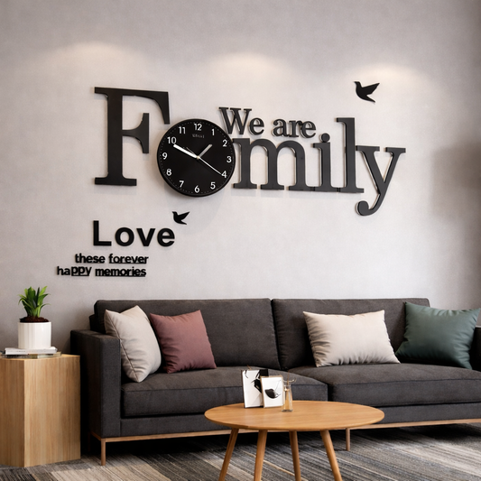 Large We Are Family wall clock in all-matte black MDF wood with matching black dial.