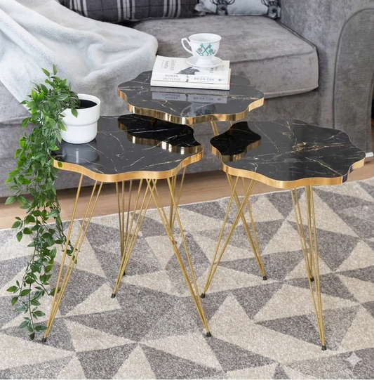 Set of 3 modern nesting coffee tables with white marble tops and gold metal legs on a clean background.