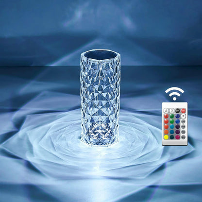 Crystal vase with a remote control on a blue textured background